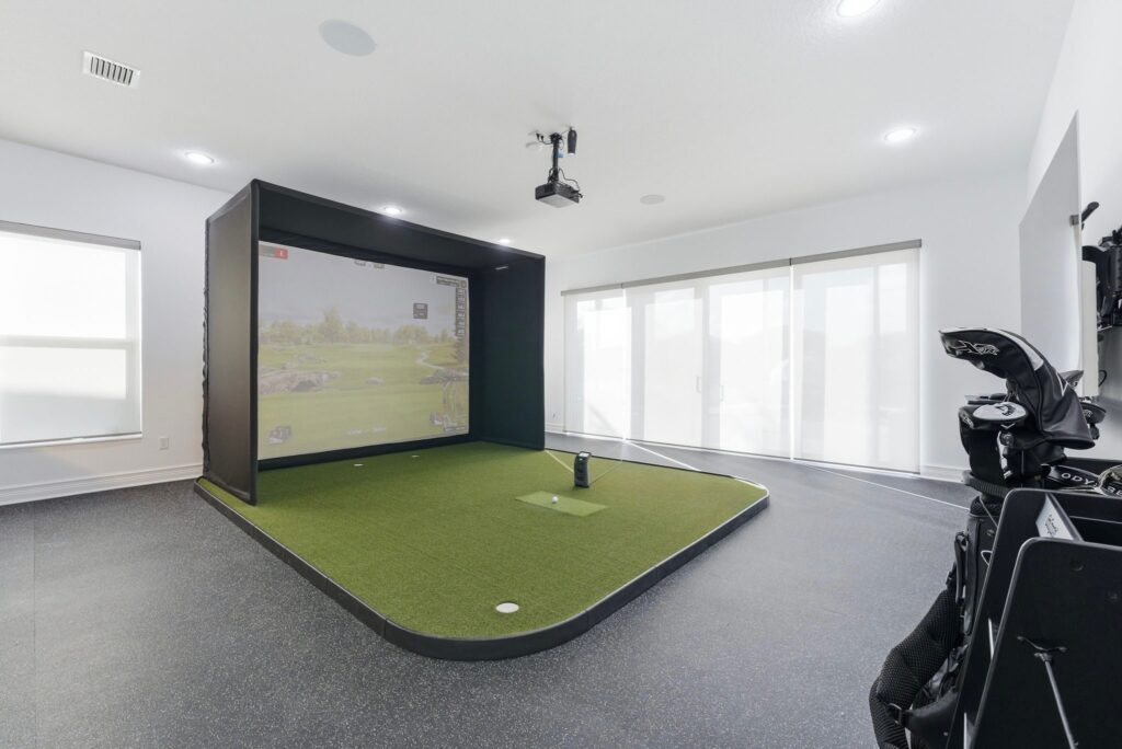 Luxury Golf Simulator installation in a modern home featuring a premium impact screen, projector, turf flooring, and professional simulator setup by GOLF365.